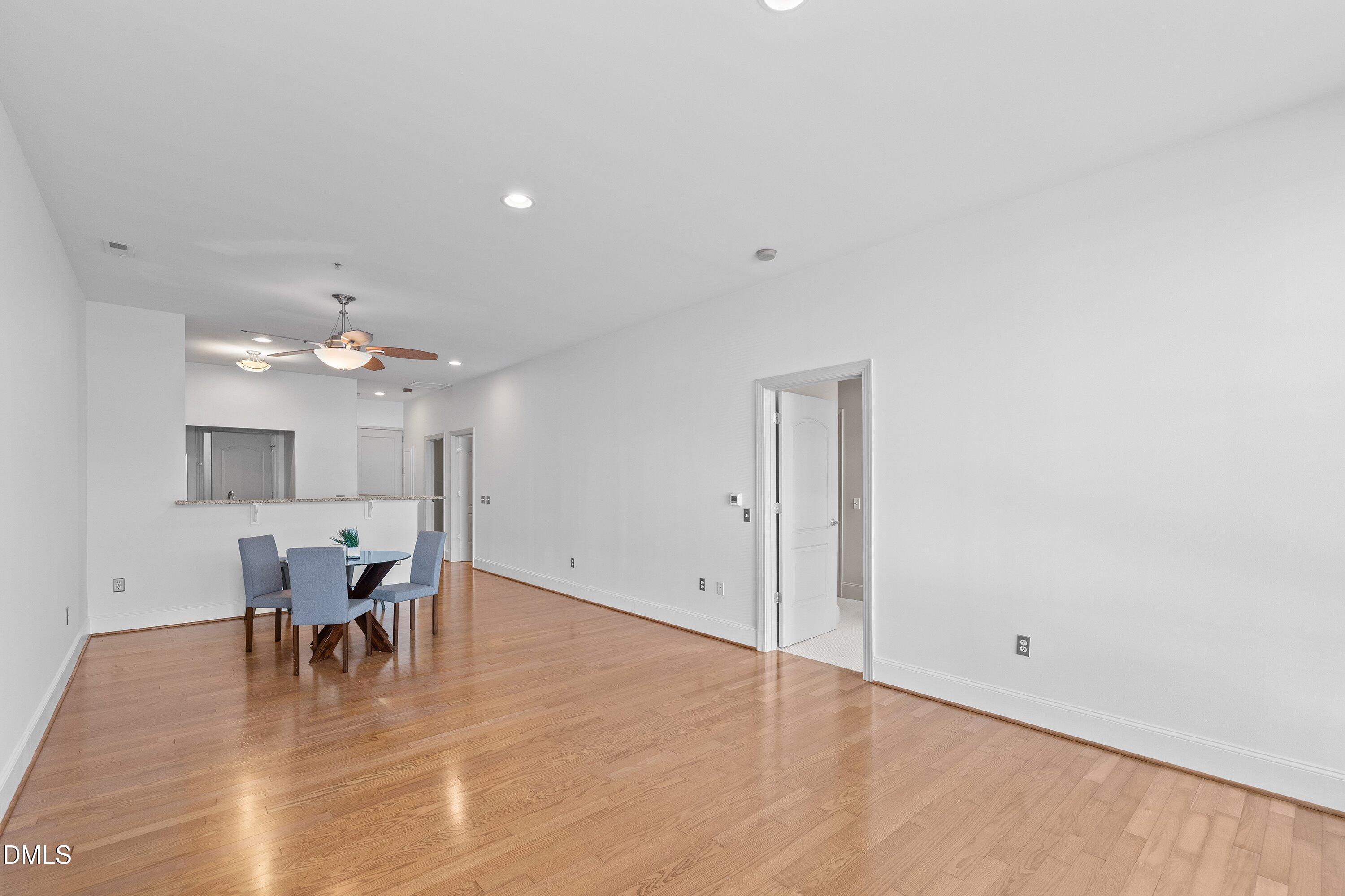 317 West Morgan Street, Unit 215 Raleigh, NC 27601 - Photo 25 of 38 a view of a dining room with furniture and chandelier