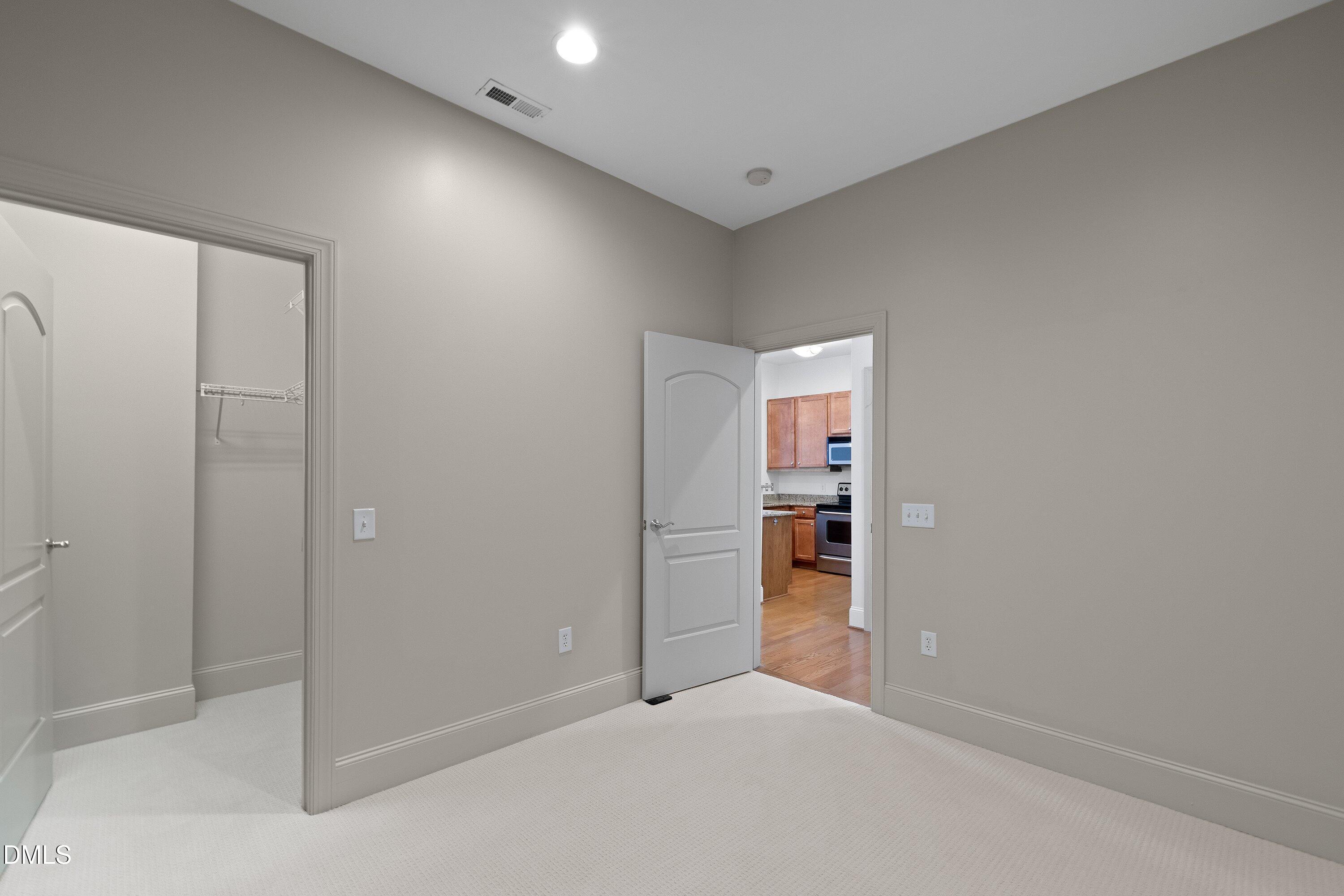 317 West Morgan Street, Unit 215 Raleigh, NC 27601 - Photo 28 of 38 a view of an empty room