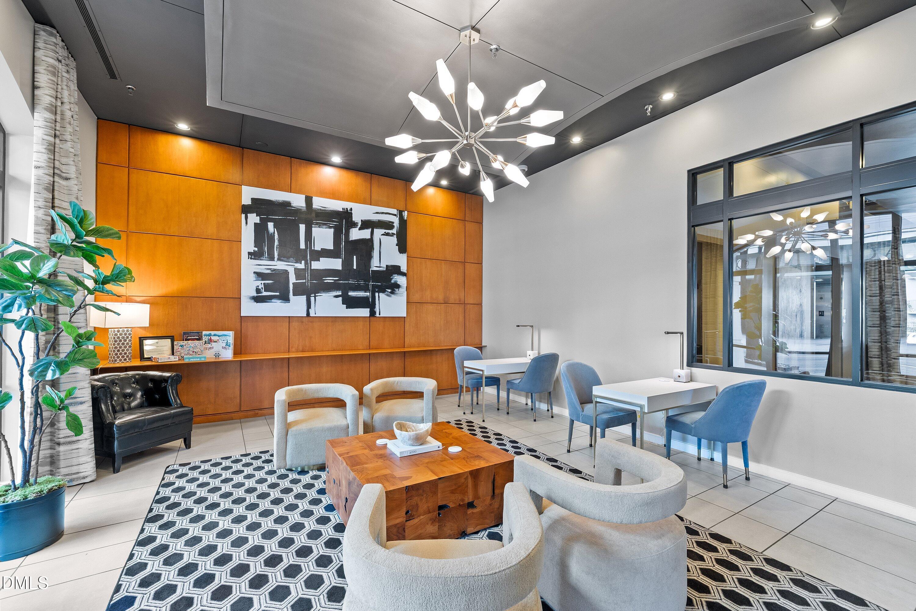 317 West Morgan Street, Unit 215 Raleigh, NC 27601 - Photo 33 of 38 a view of a dining room with furniture and chandelier