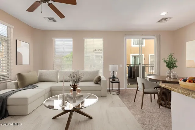 a living room with furniture and a large window