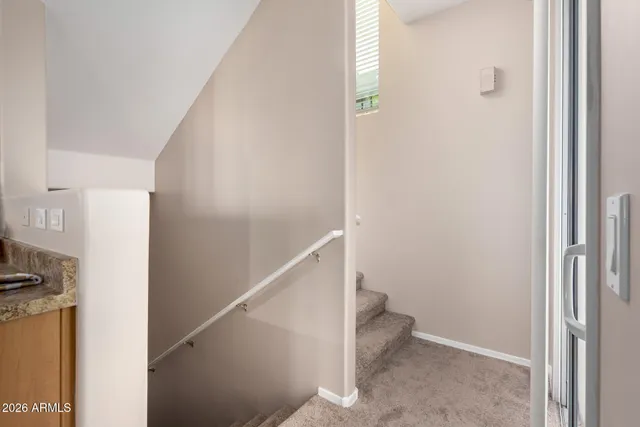 a view of entryway and kitchen