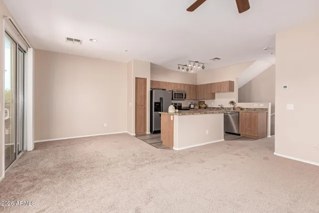 a view of a kitchen with a sink cabinets and a window