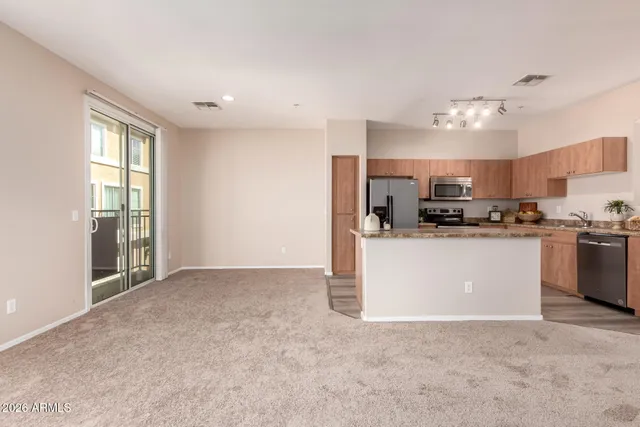 a view of a kitchen with microwave and cabinets