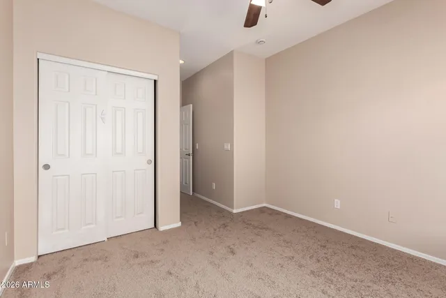 an empty room with a empty space and windows