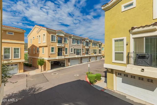 a view of swimming pool with outdoor seating and a pathway