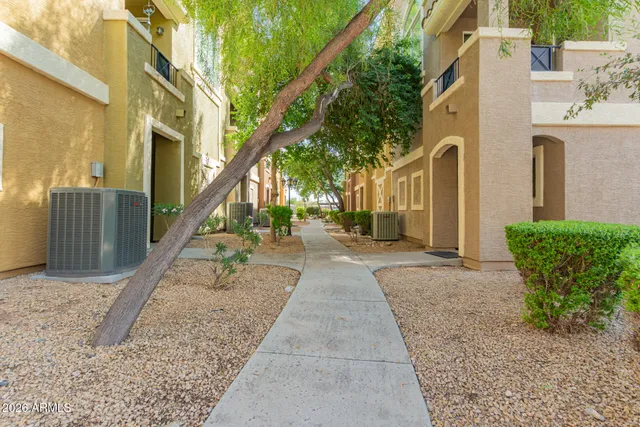 a view of a brick house with many windows