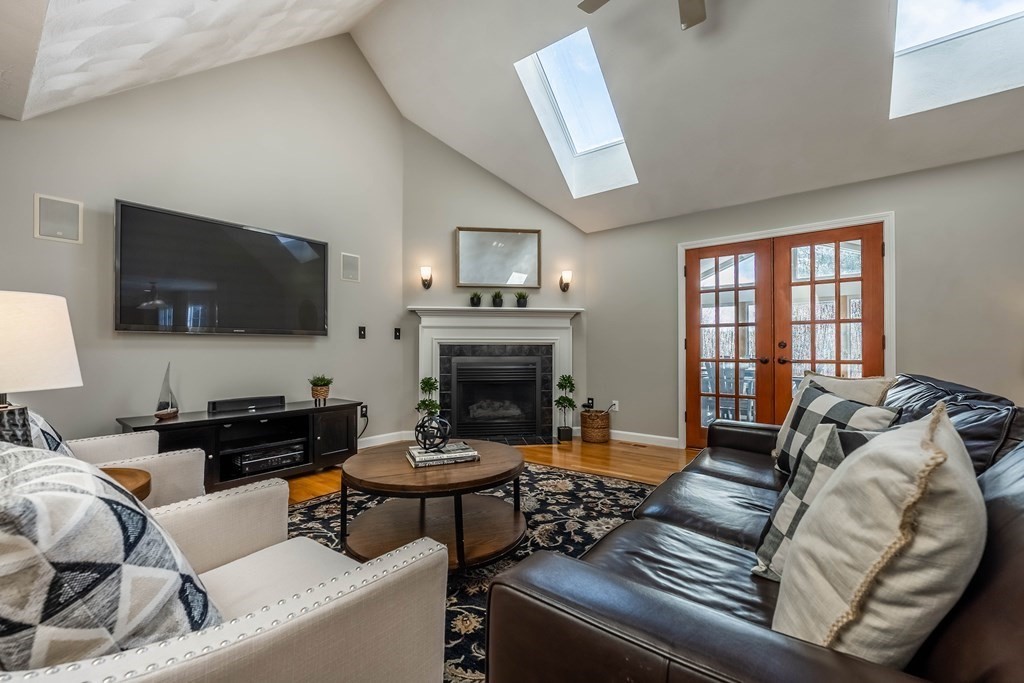 5 Devonshire Place Andover, MA 01810 - Photo 12 of 42 a living room with furniture fireplace and a flat screen tv