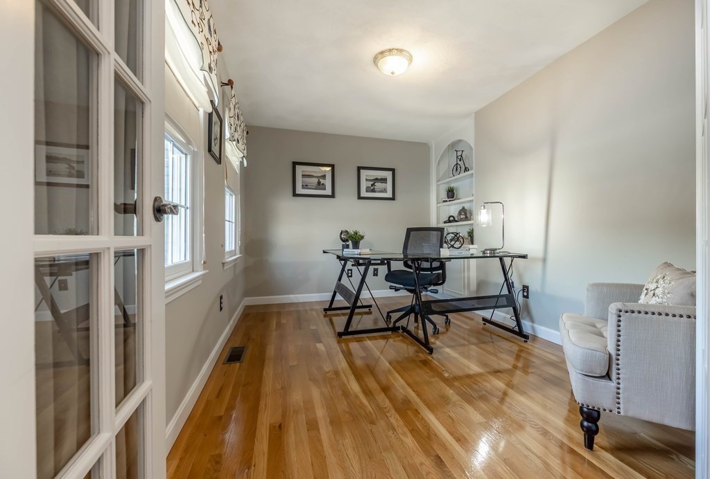 5 Devonshire Place Andover, MA 01810 - Photo 19 of 42 a living room with furniture and a wooden floor