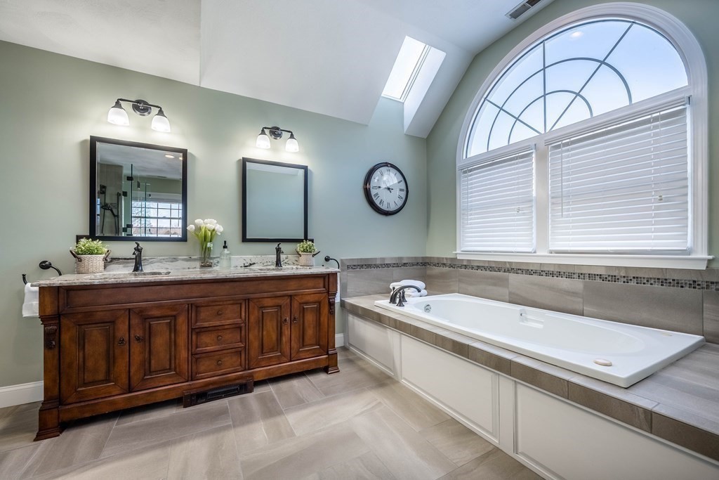 5 Devonshire Place Andover, MA 01810 - Photo 25 of 42 a spacious bathroom with a tub a double vanity sink and a large mirror