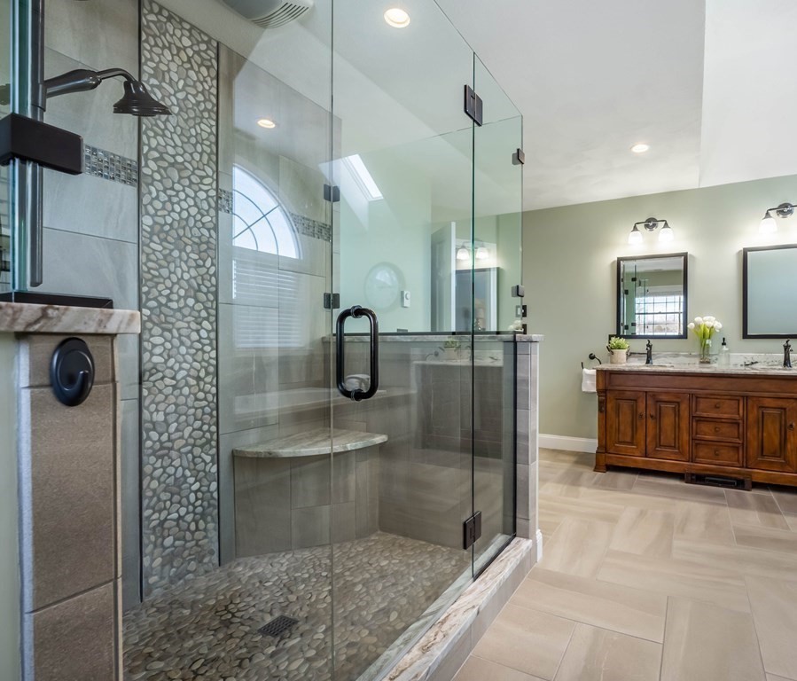 5 Devonshire Place Andover, MA 01810 - Photo 26 of 42 a bathroom with a sink a counter and a shower