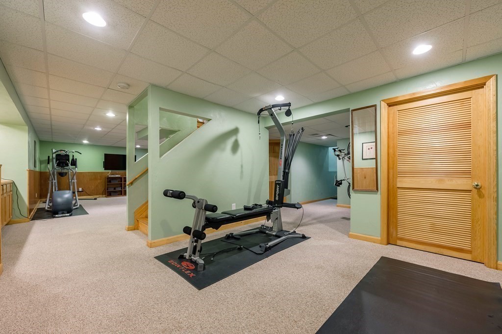 5 Devonshire Place Andover, MA 01810 - Photo 36 of 42 a room with gym equipment and a table