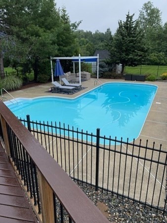 5 Devonshire Place Andover, MA 01810 - Photo 40 of 42 a view of a swimming pool with a patio