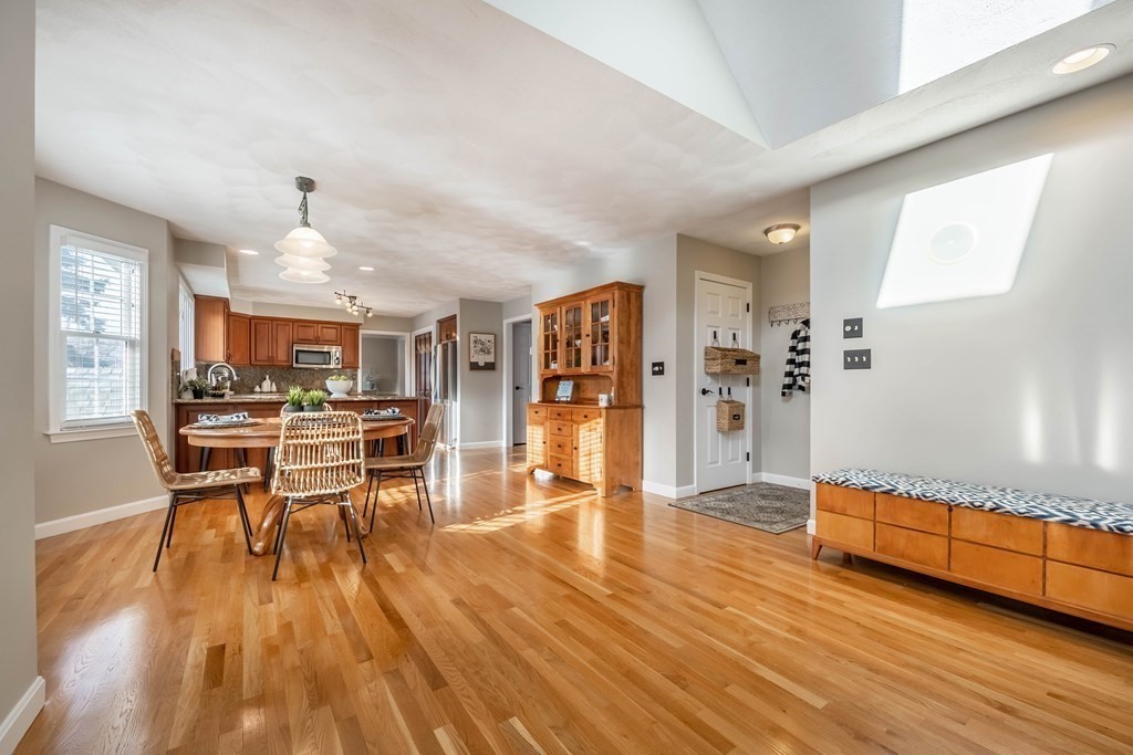 5 Devonshire Place Andover, MA 01810 - Photo 4 of 42 a view of a living room a dining room wooden floor and a window
