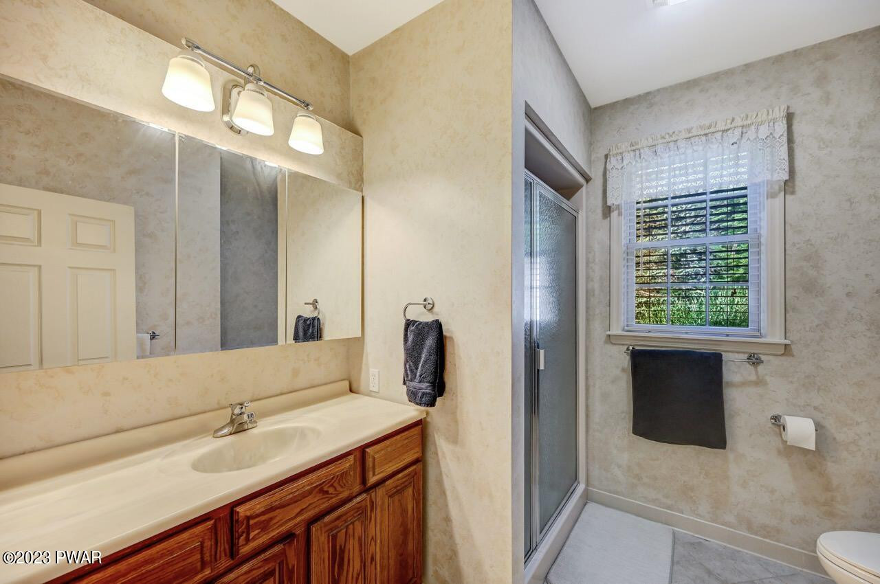 883 Goose Pond Road Lake Ariel, PA 18436 - Photo 34 of 70 a bathroom with a sink and a mirror