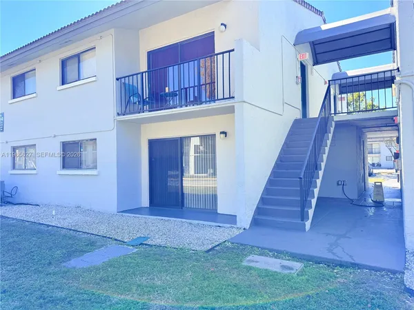 a view of front door with stairs