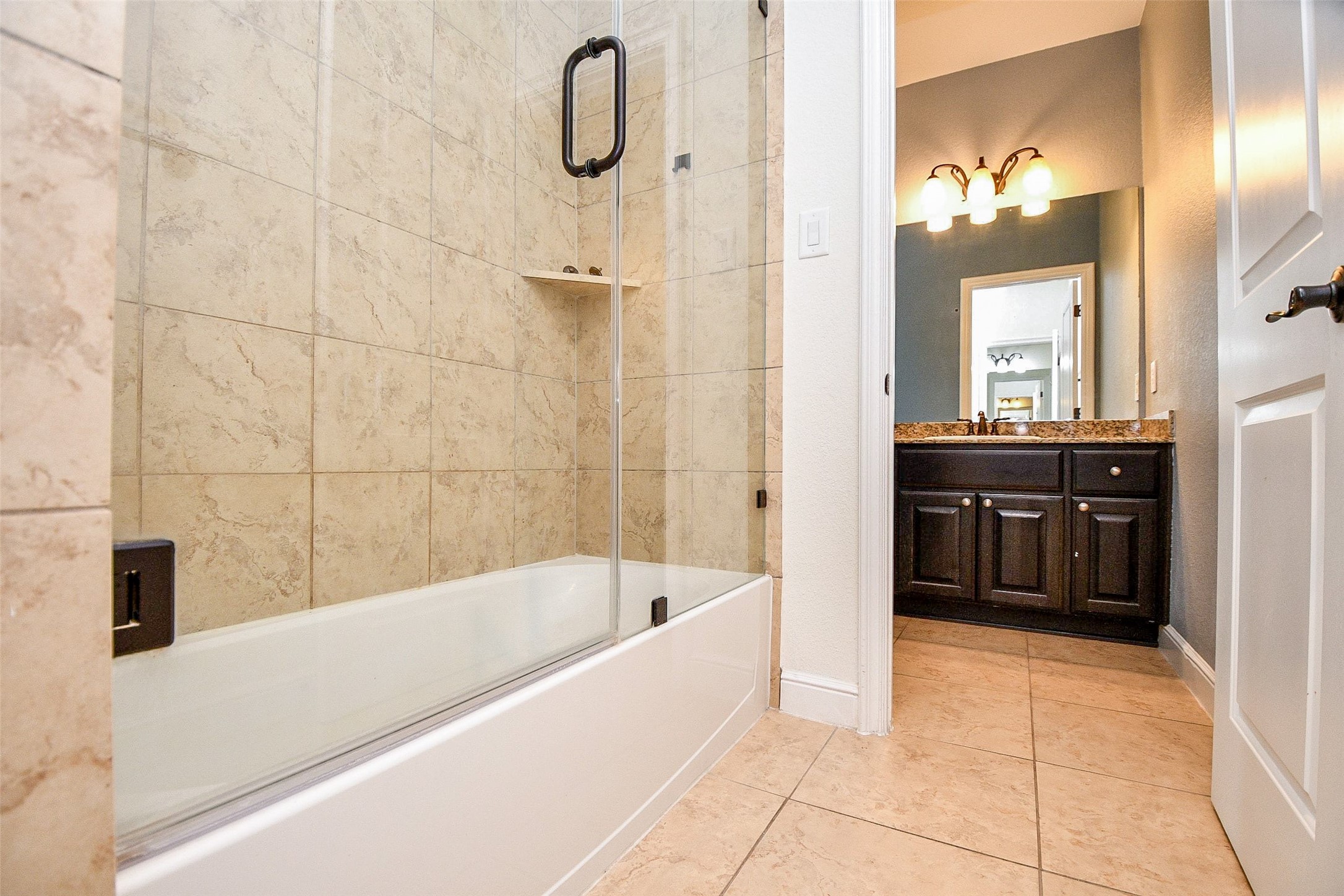 24914 Bay Mist Ridge Lane Katy, TX 77494 - Photo 10 of 50 A full soaking bathtub graces this secondary bathroom.