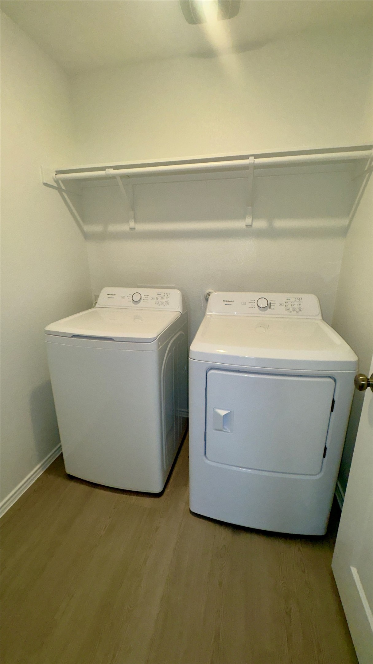 1541 Boggy Crk Rnch Road Georgetown, TX 78628 - Photo 13 of 30 Laundry area with light wood-type flooring and independent washer and dryer