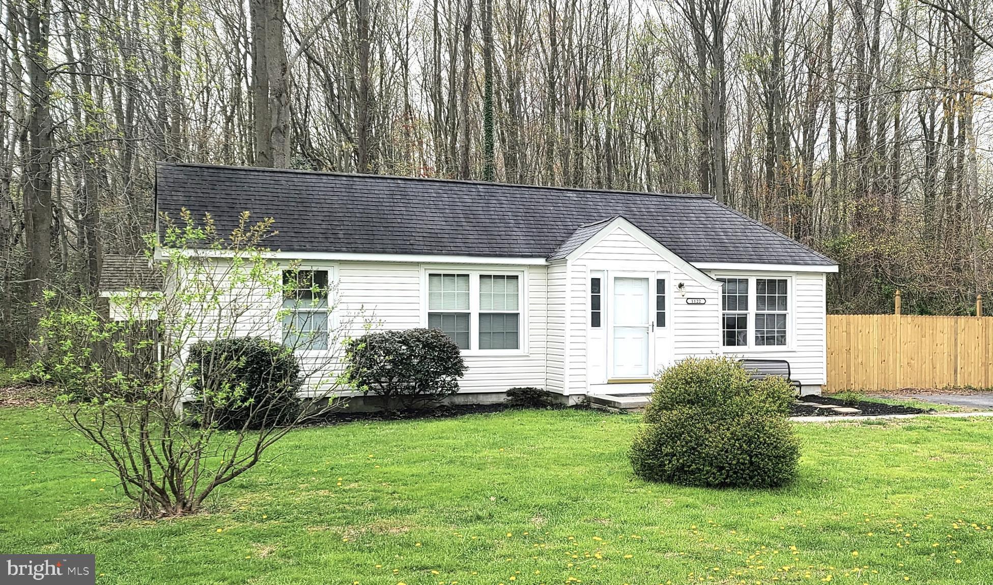 a house view with a garden space