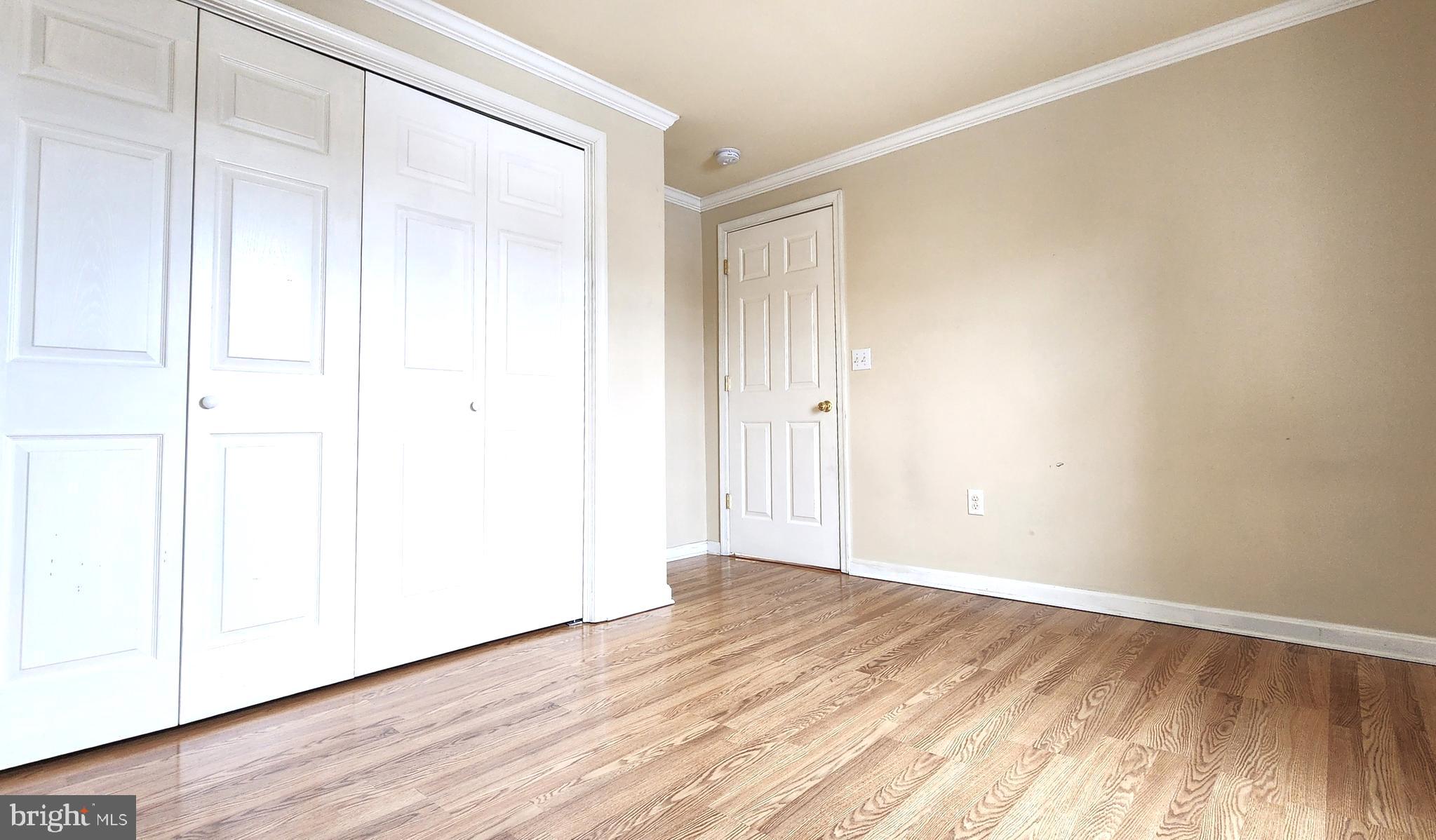 1122 Horsepond Road Dover, DE 19901 - Photo 17 of 26 a view of an empty room with wooden floor