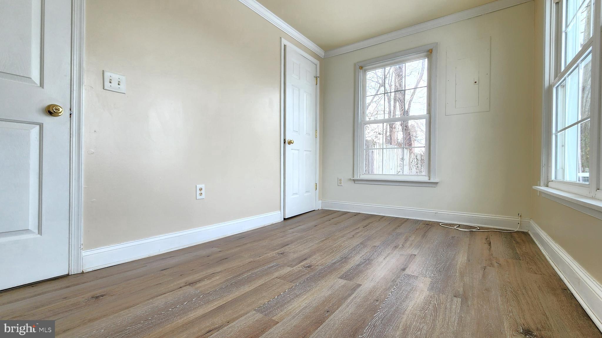 1122 Horsepond Road Dover, DE 19901 - Photo 21 of 26 an empty room with wooden floor and windows