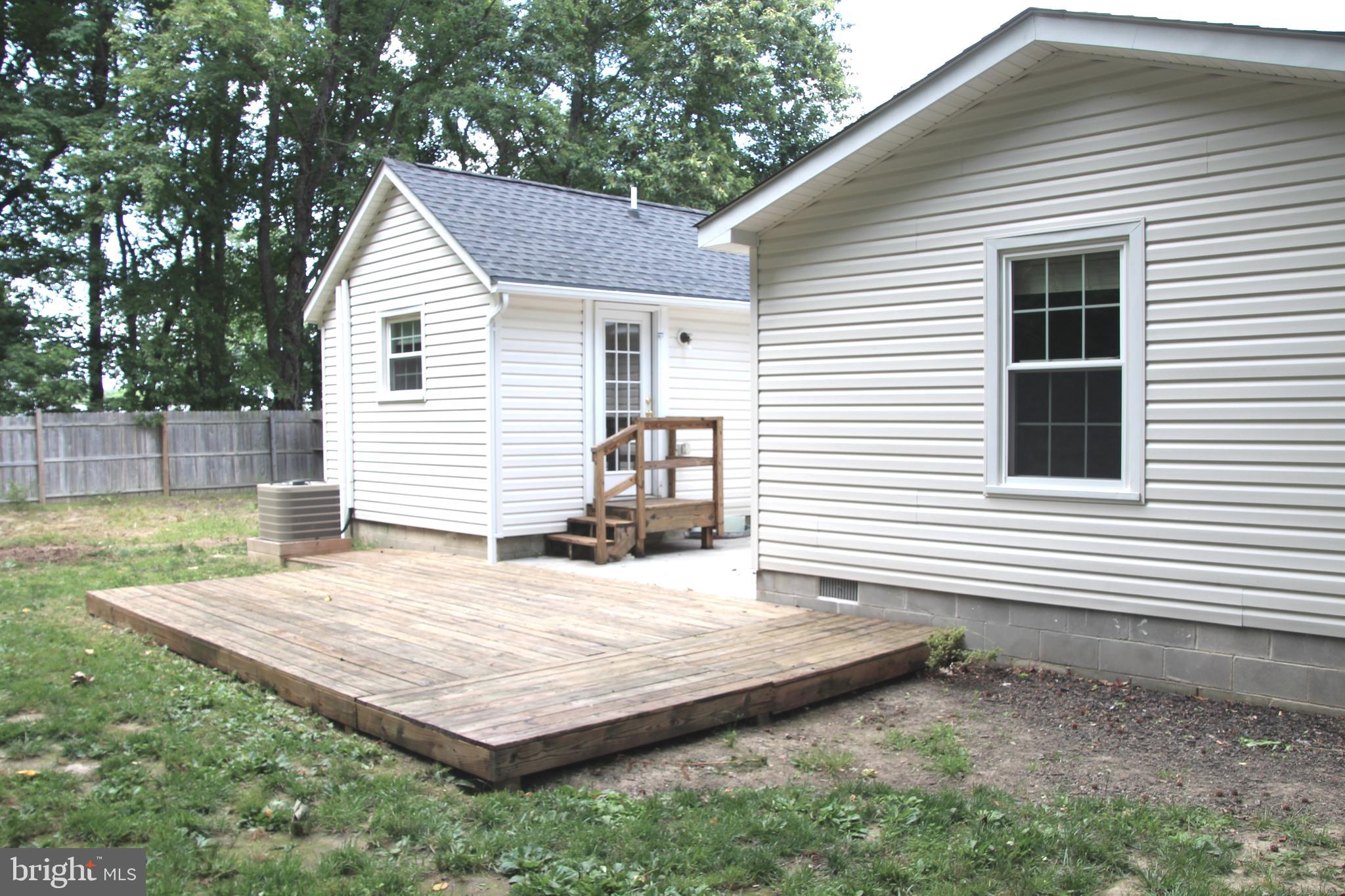 1122 Horsepond Road Dover, DE 19901 - Photo 3 of 26 a view of a house with a wooden deck