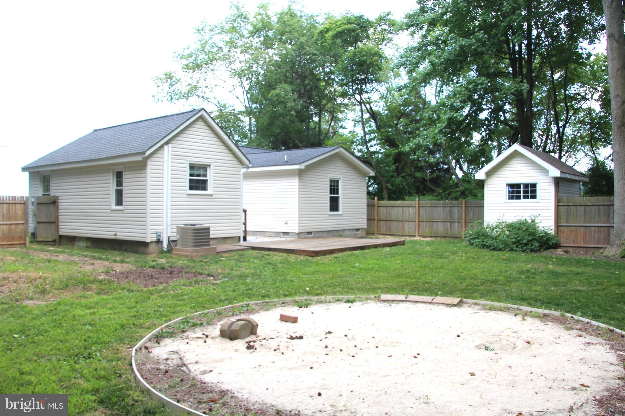 1122 Horsepond Road Dover, DE 19901 - Photo 4 of 26 a view of a backyard with a garden and plants