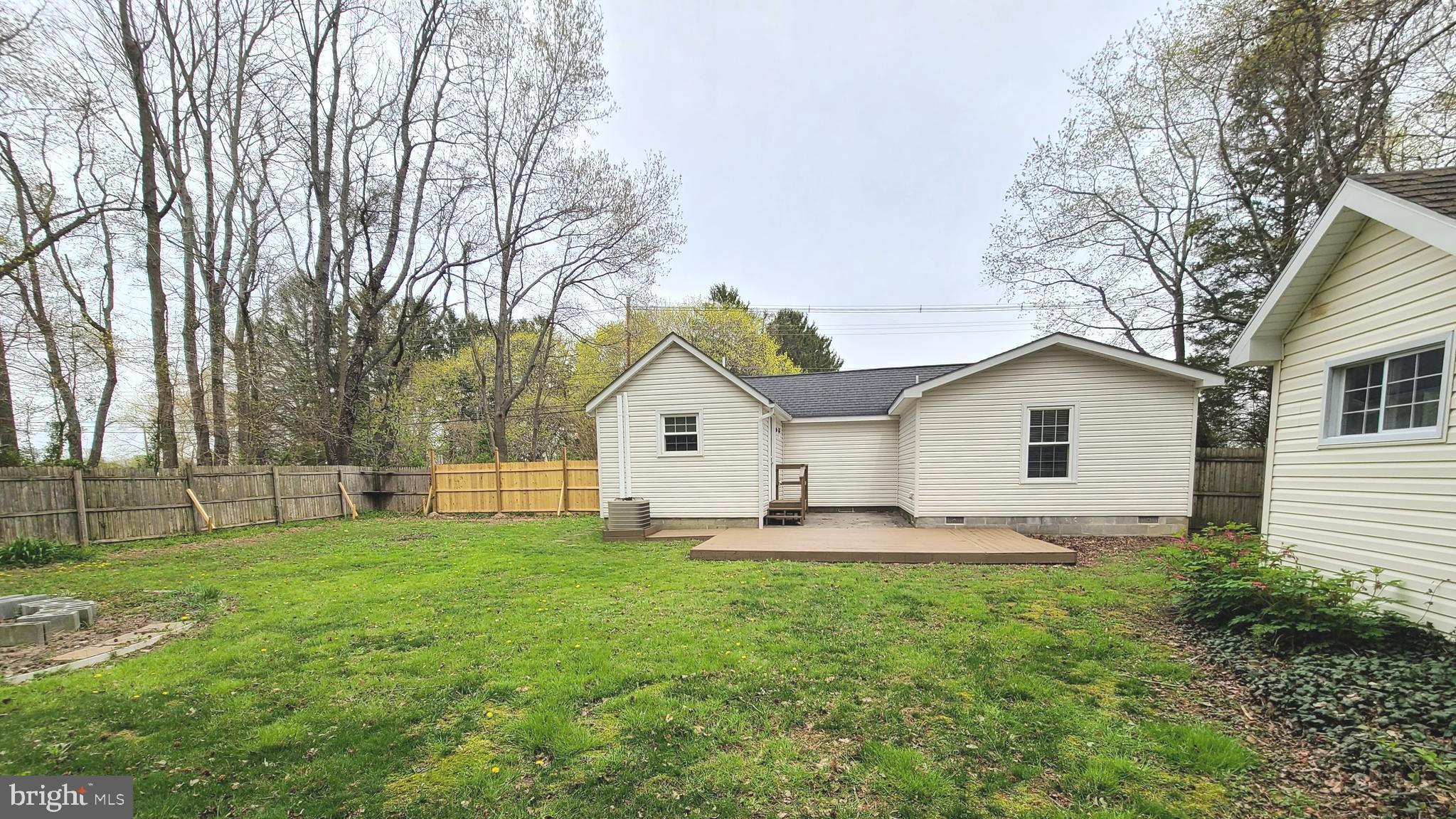 1122 Horsepond Road Dover, DE 19901 - Photo 6 of 26 a front view of house with yard and trees all around