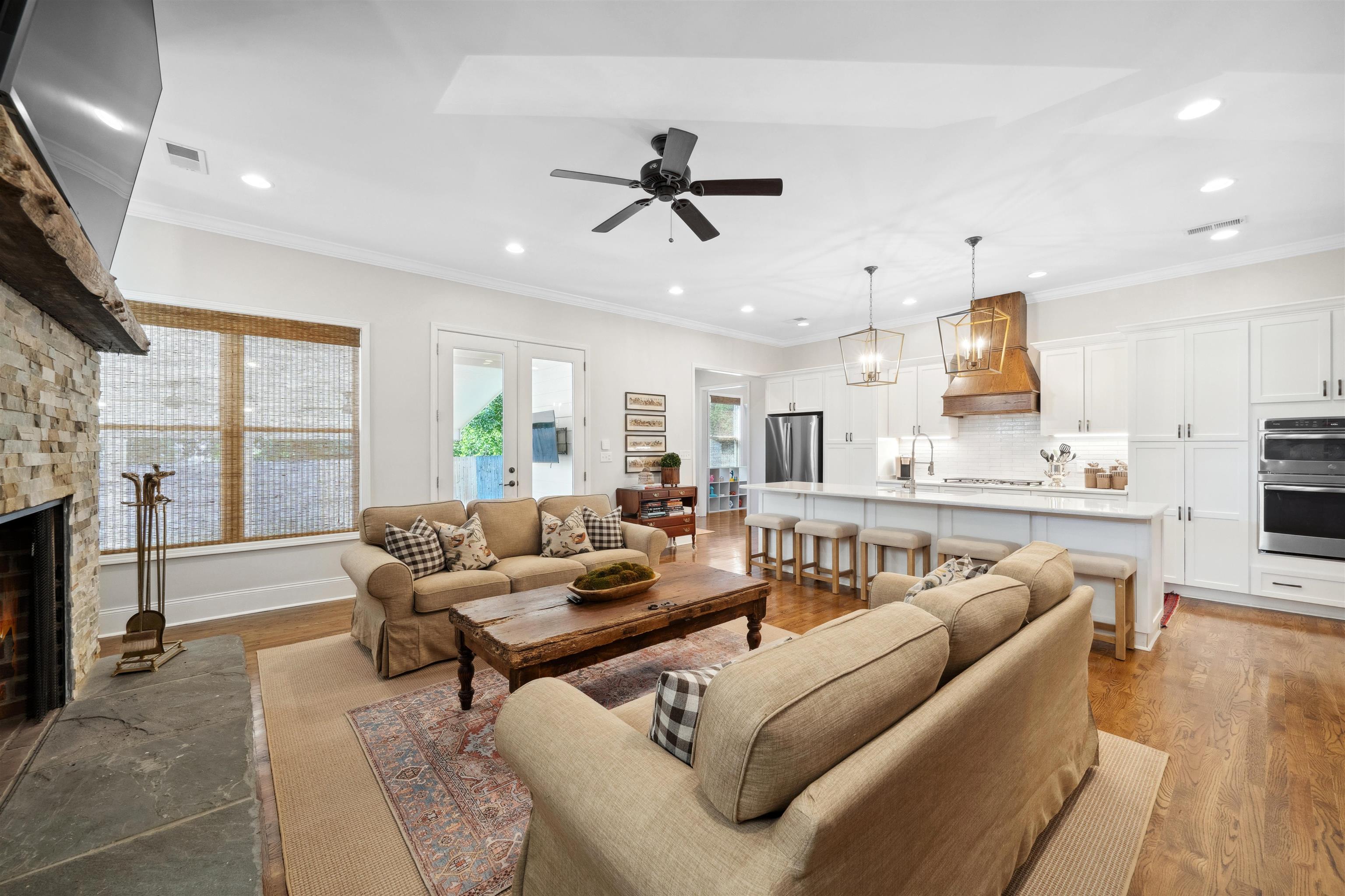 3794 Rosedale Drive Memphis, TN 38111 - Photo 11 of 33 Den featuring recessed lighting, ceiling fan, a fireplace, wood finished floors, and crown molding