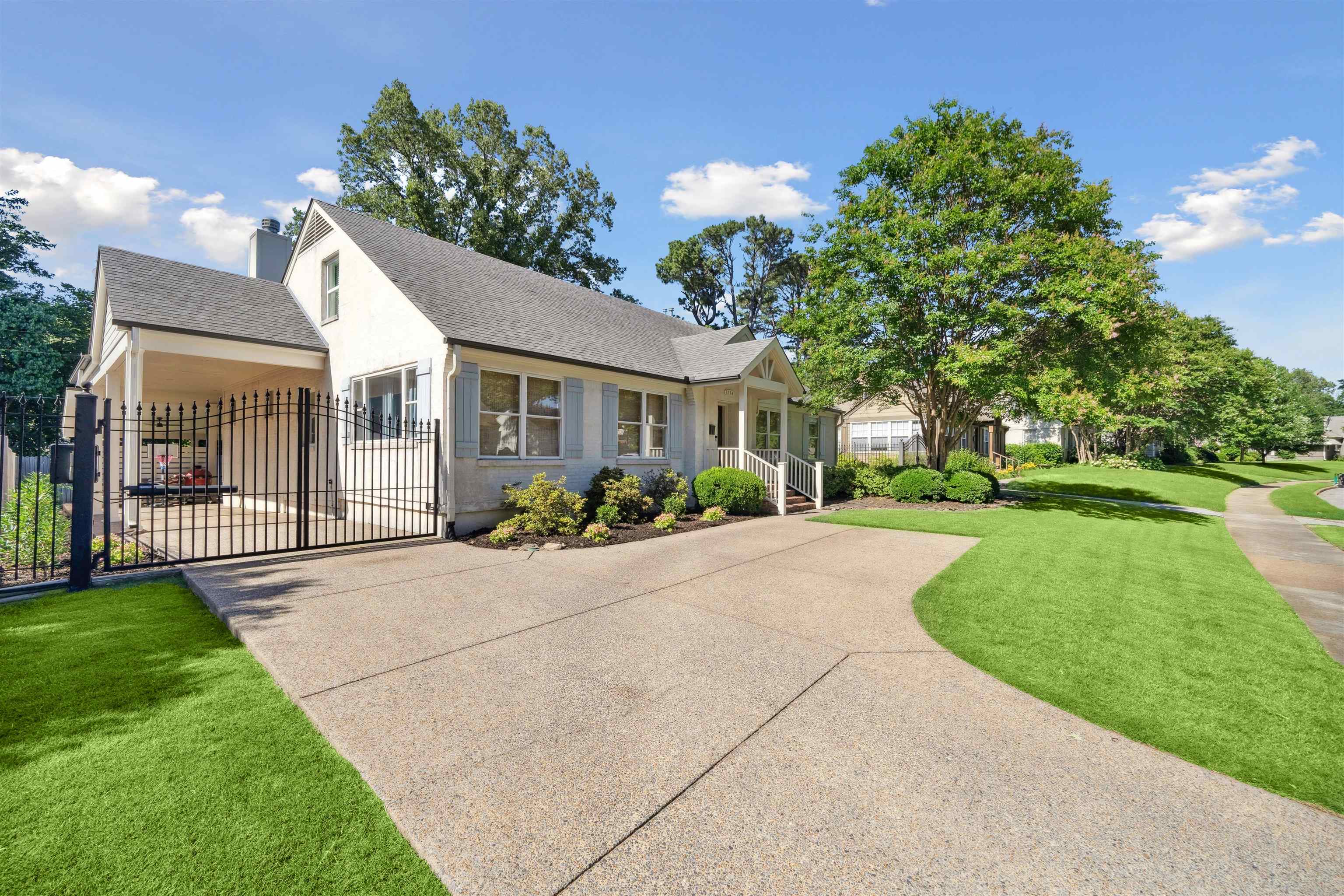 3794 Rosedale Drive Memphis, TN 38111 - Photo 2 of 33 View of front of property featuring driveway, a gate, and a shingled roof