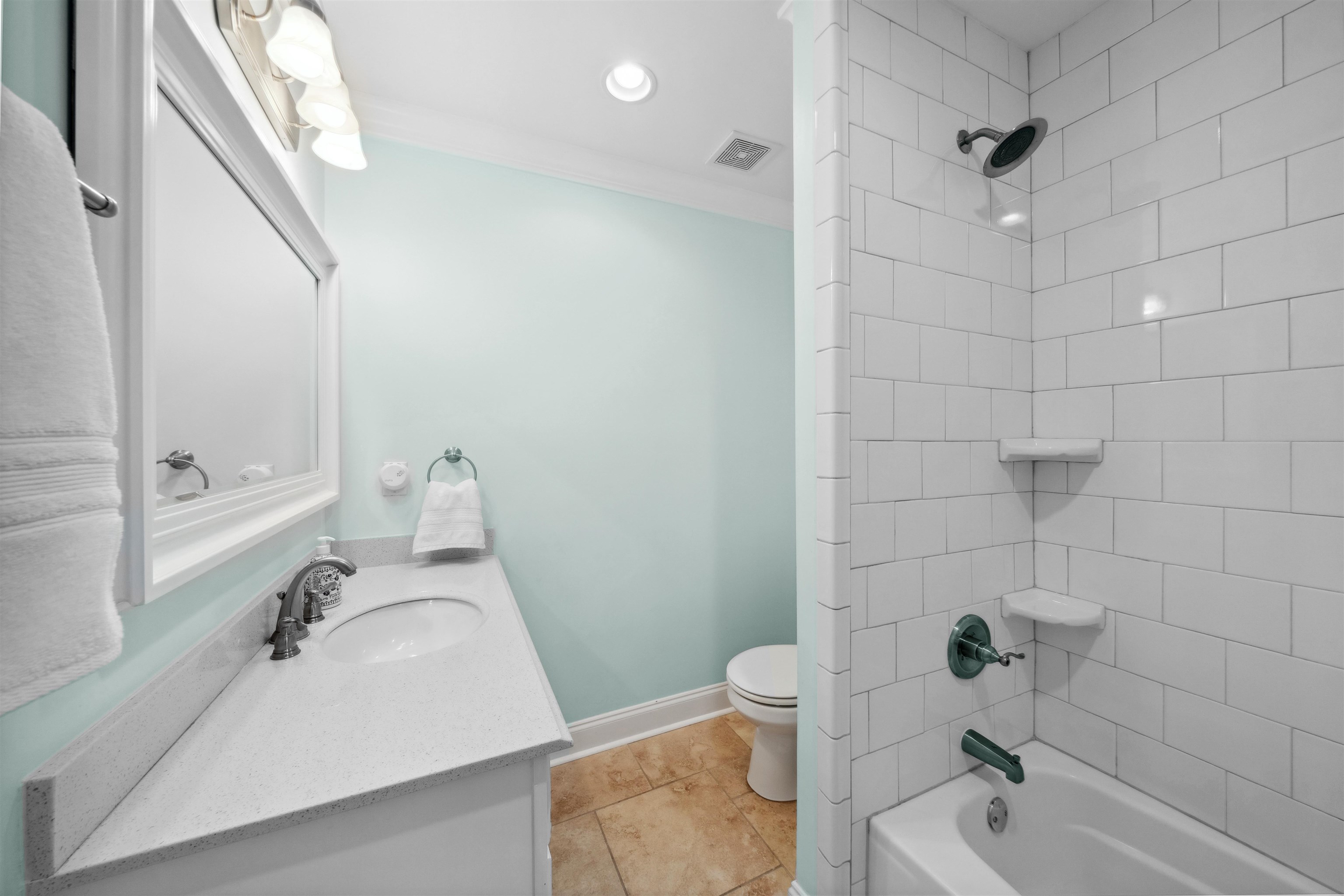 3794 Rosedale Drive Memphis, TN 38111 - Photo 22 of 33 Shared downstairs Bathroom with toilet, vanity, shower / tub combination, crown molding, and tile patterned floors