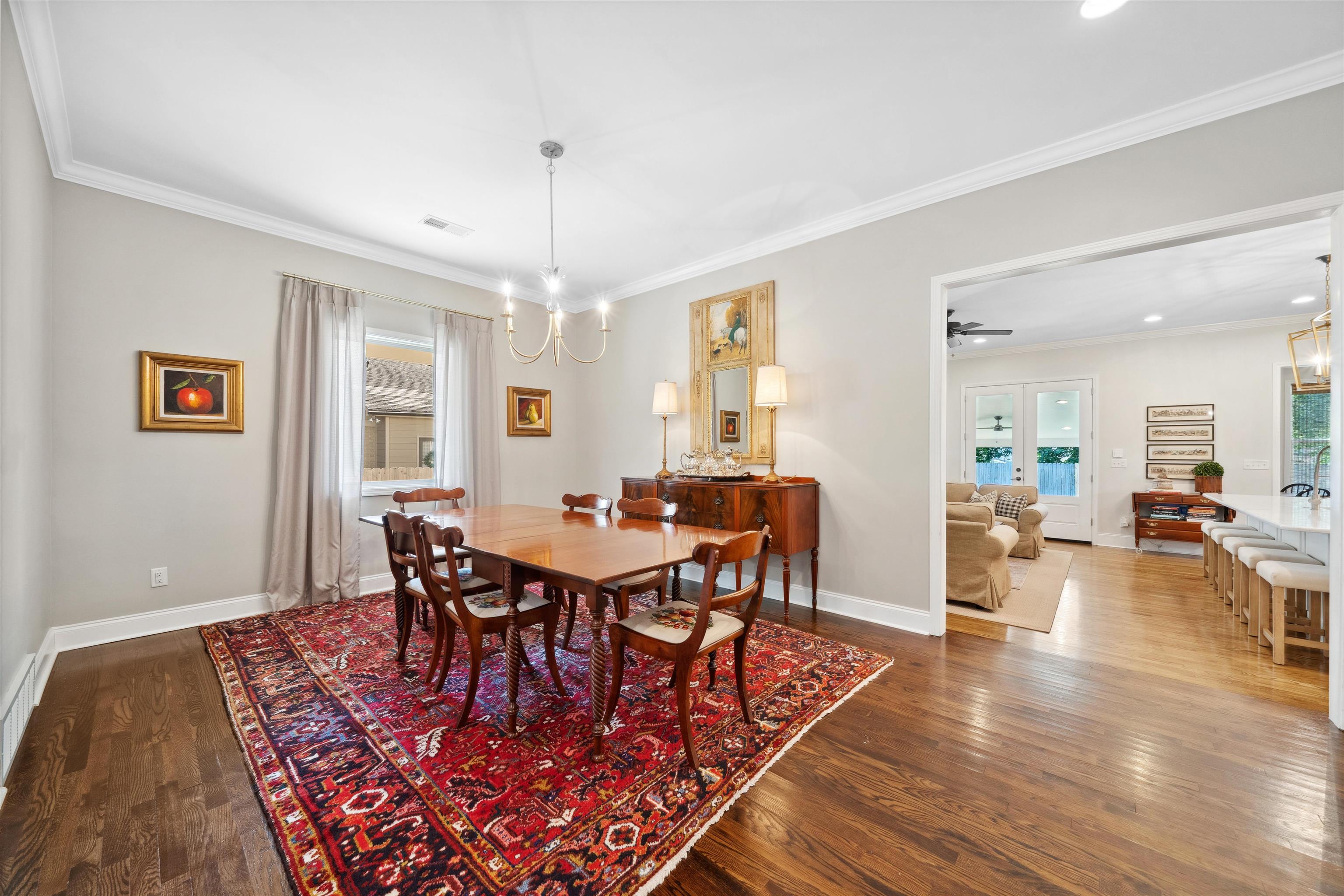 3794 Rosedale Drive Memphis, TN 38111 - Photo 7 of 33 Dining space featuring plenty of natural light, wood finished floors, baseboards, ornamental molding, and a chandelier