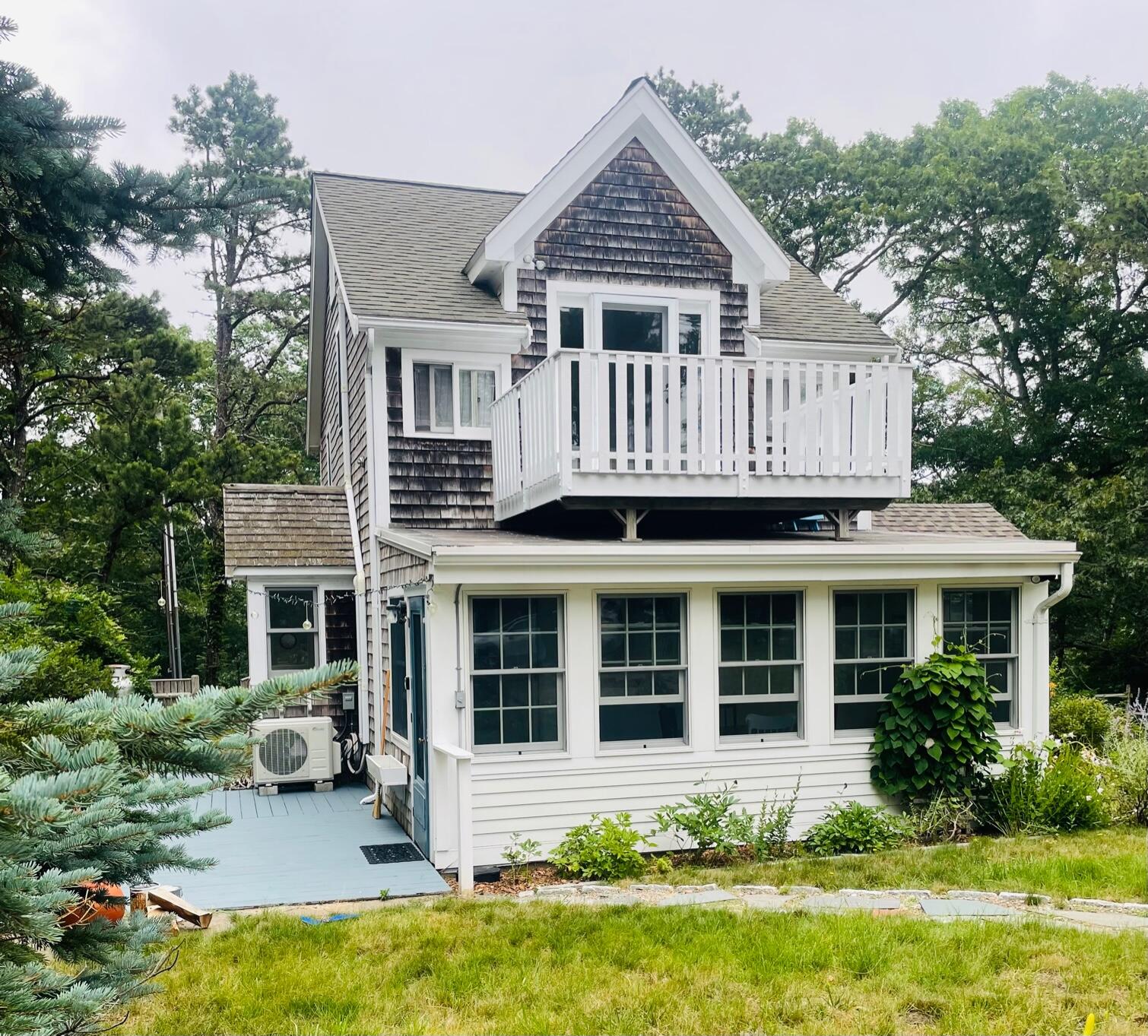 122 Gull Pond Road Wellfleet, MA 02667 - Photo 1 of 26 a view of a house with yard and sitting area