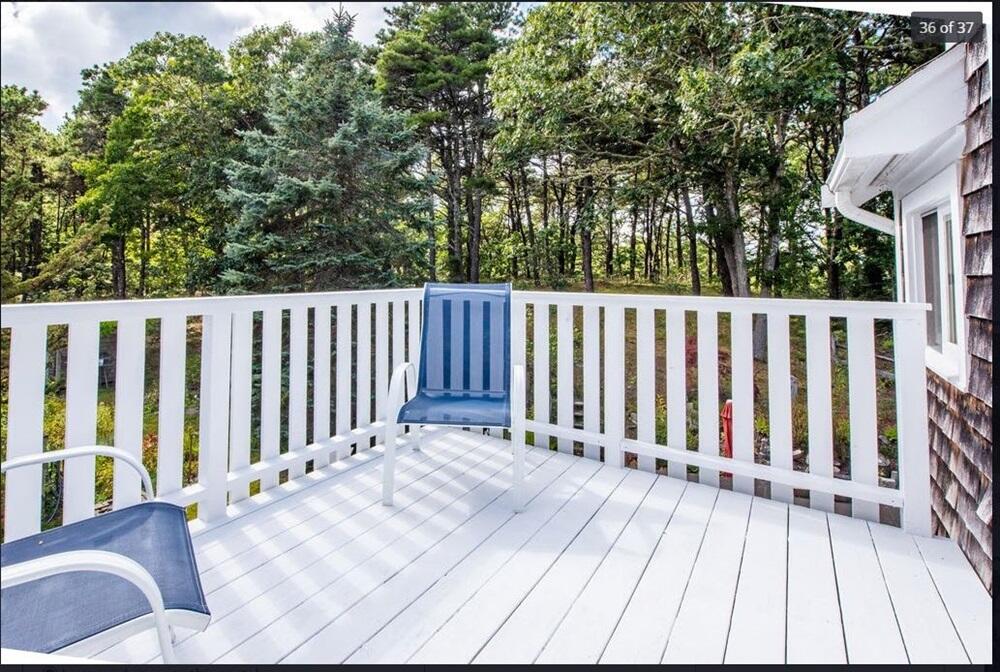 122 Gull Pond Road Wellfleet, MA 02667 - Photo 14 of 26 a view of a wooden roof with trees