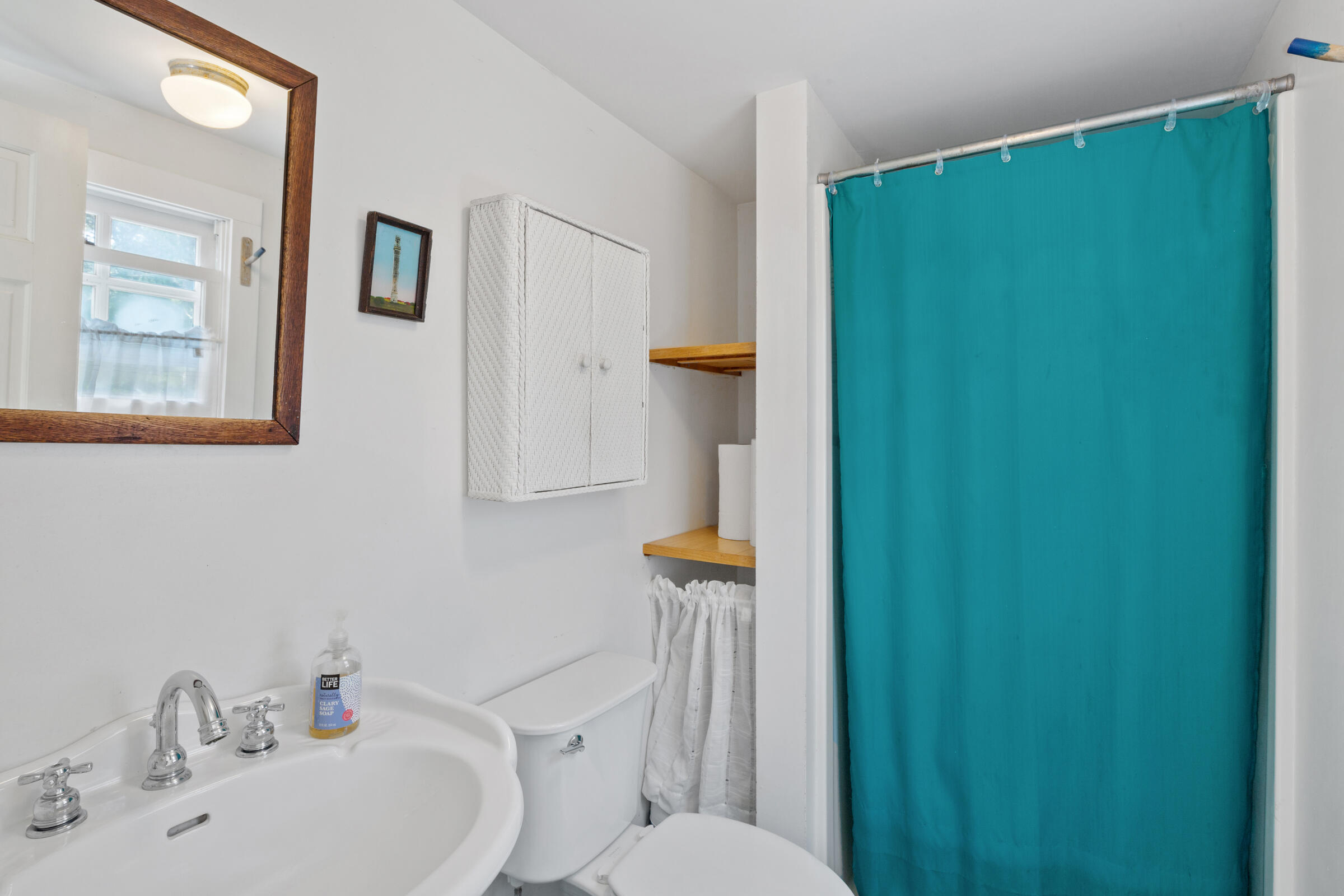 122 Gull Pond Road Wellfleet, MA 02667 - Photo 15 of 26 a bathroom with a sink a toilet and shower