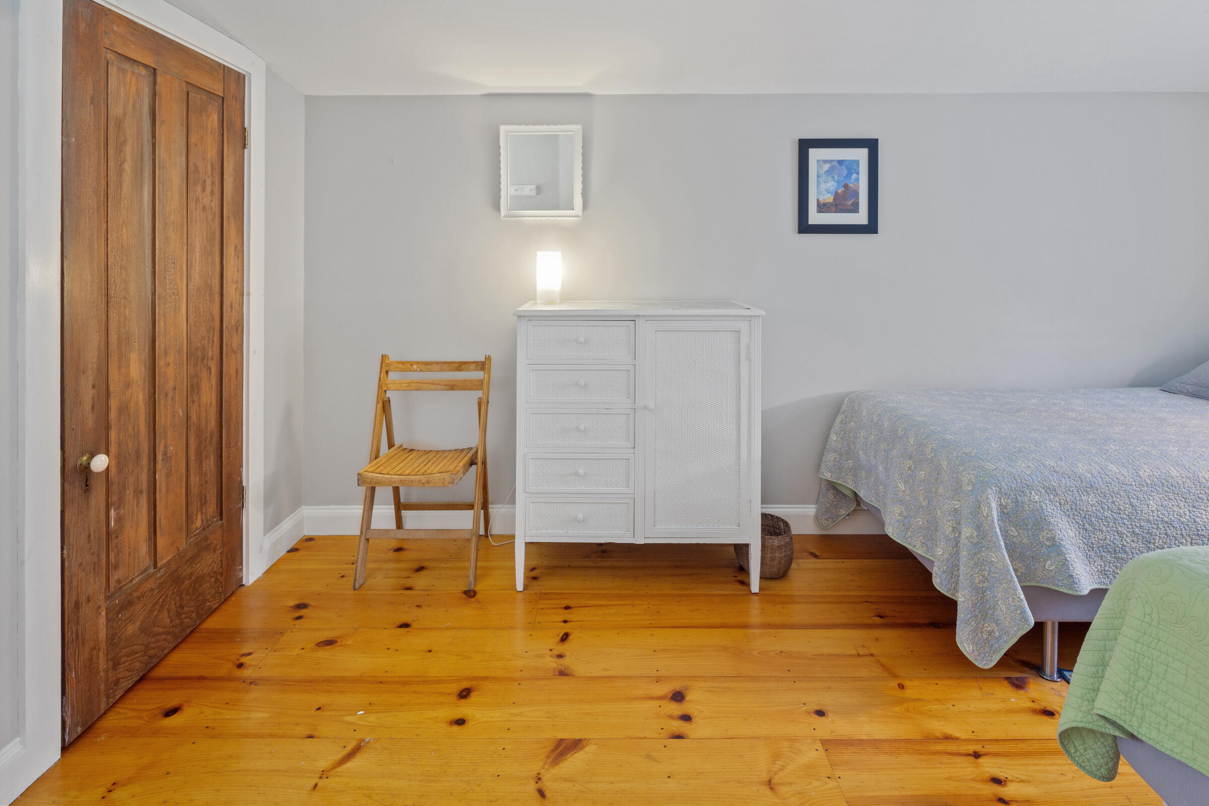 122 Gull Pond Road Wellfleet, MA 02667 - Photo 16 of 26 a bedroom with a bed and a table in it