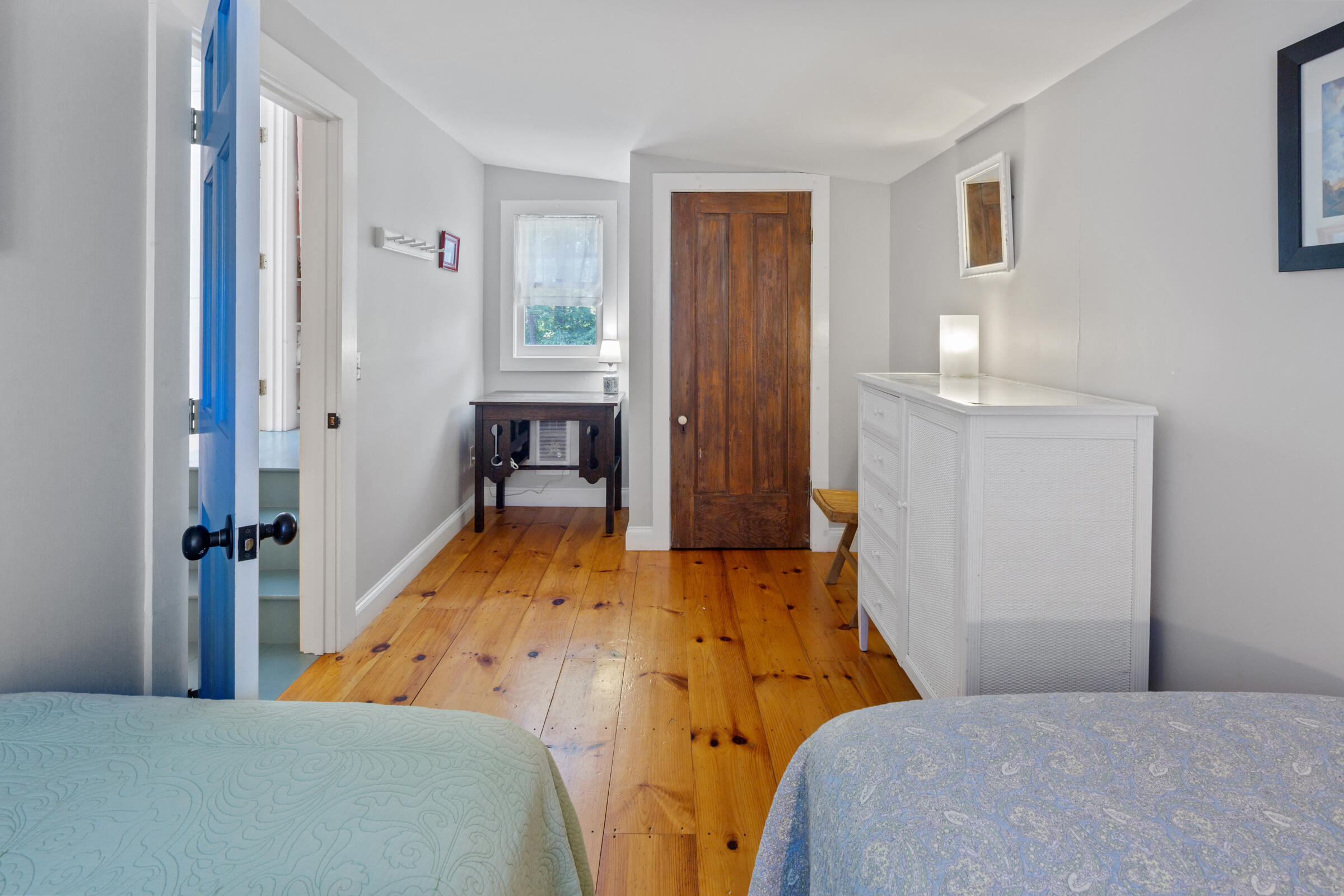 122 Gull Pond Road Wellfleet, MA 02667 - Photo 17 of 26 a bedroom with a bed and a table