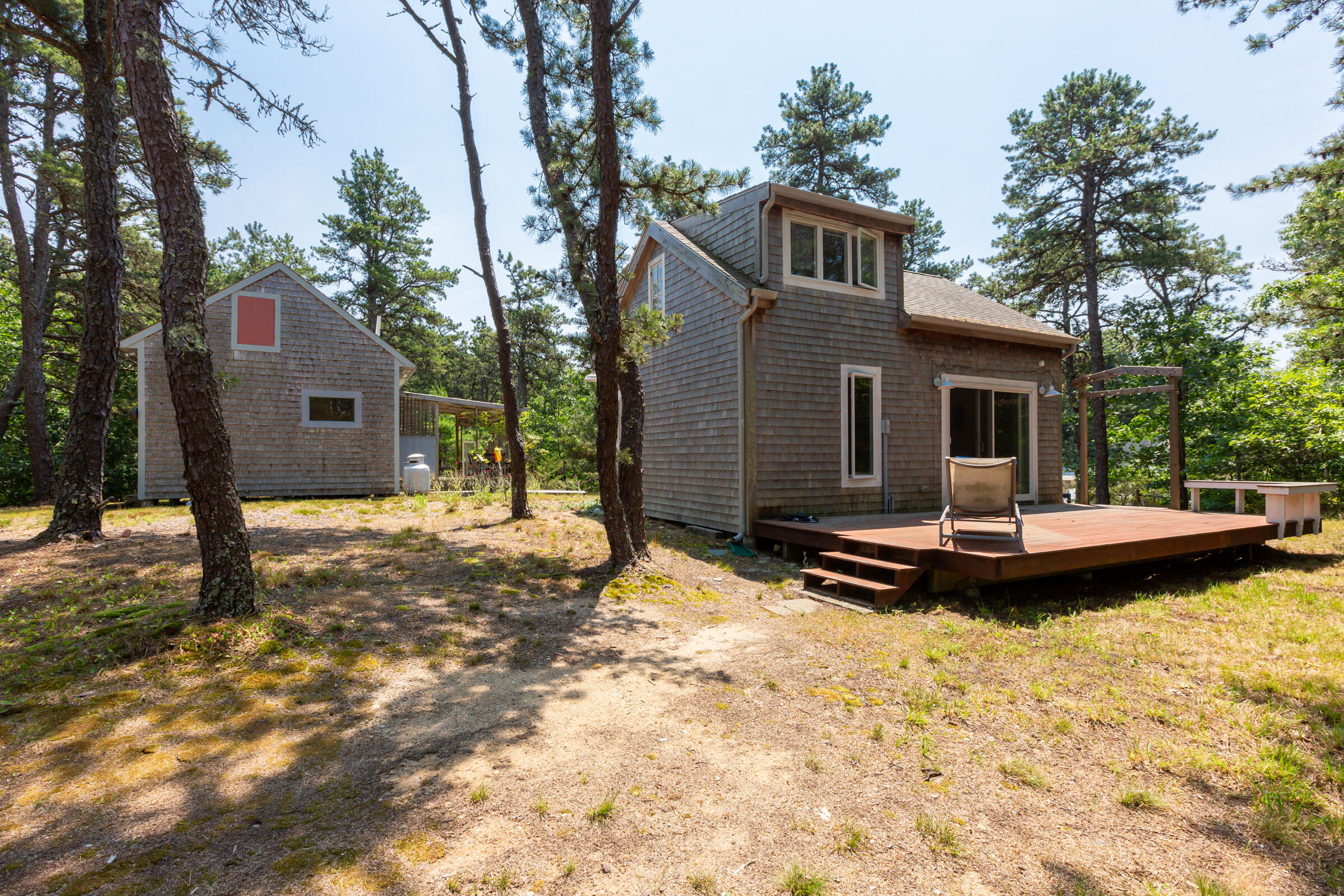 122 Gull Pond Road Wellfleet, MA 02667 - Photo 23 of 26 a view of a house with a yard covered in snow
