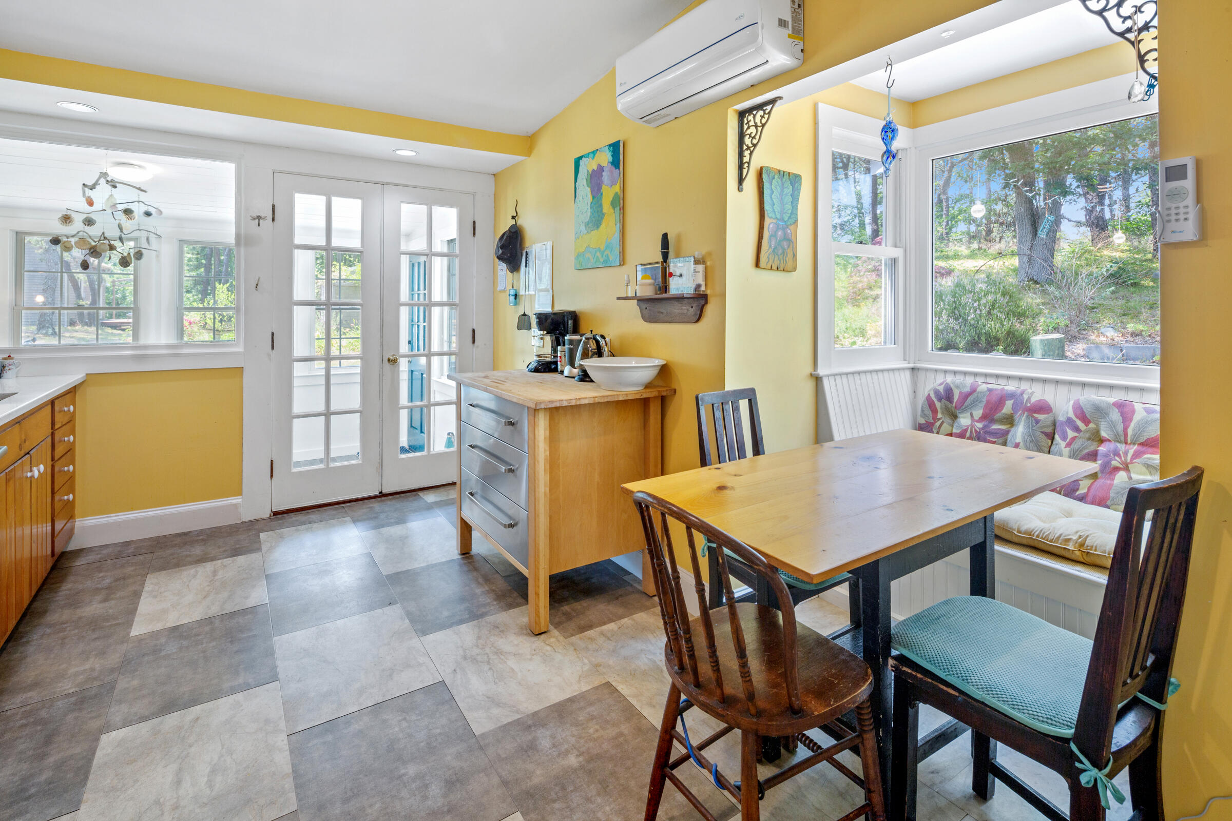 122 Gull Pond Road Wellfleet, MA 02667 - Photo 5 of 26 a view of a dining room with furniture a chandelier and wooden floor
