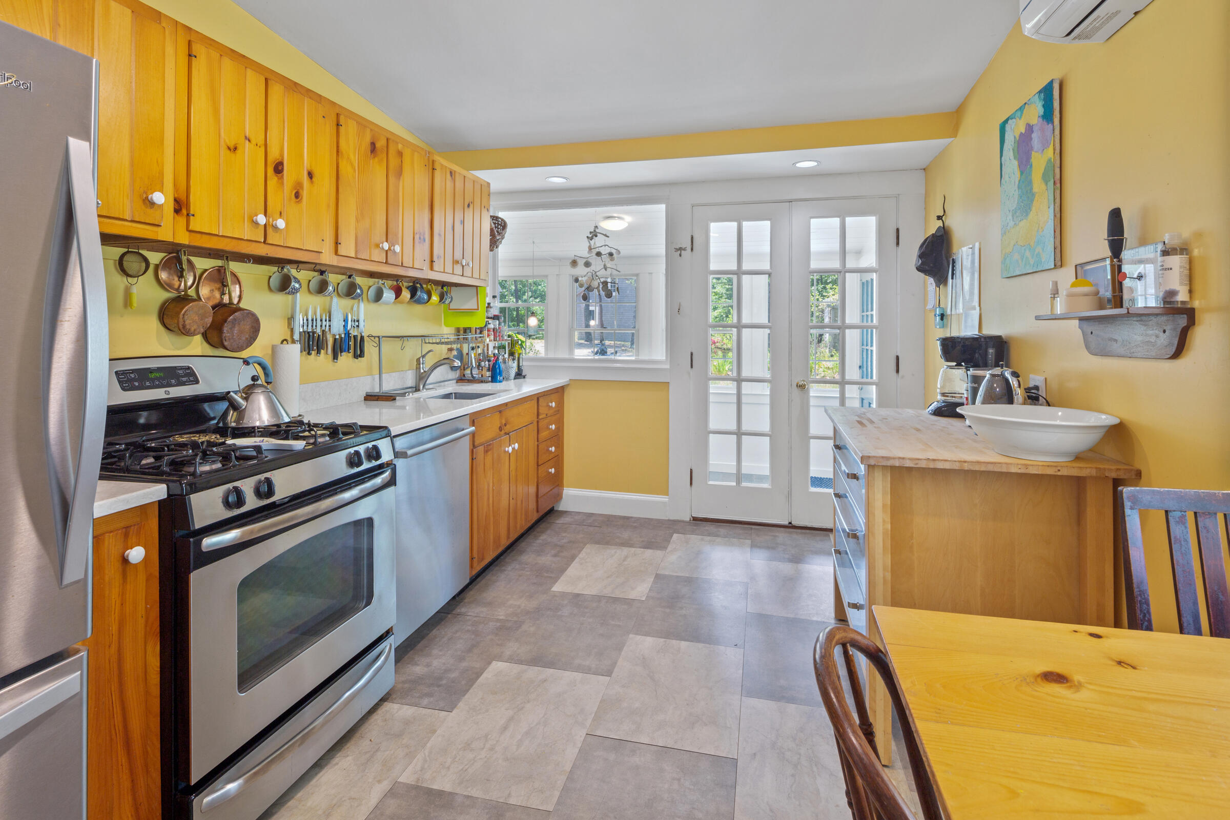 122 Gull Pond Road Wellfleet, MA 02667 - Photo 6 of 26 a kitchen with stainless steel appliances granite countertop a stove a sink and a refrigerator