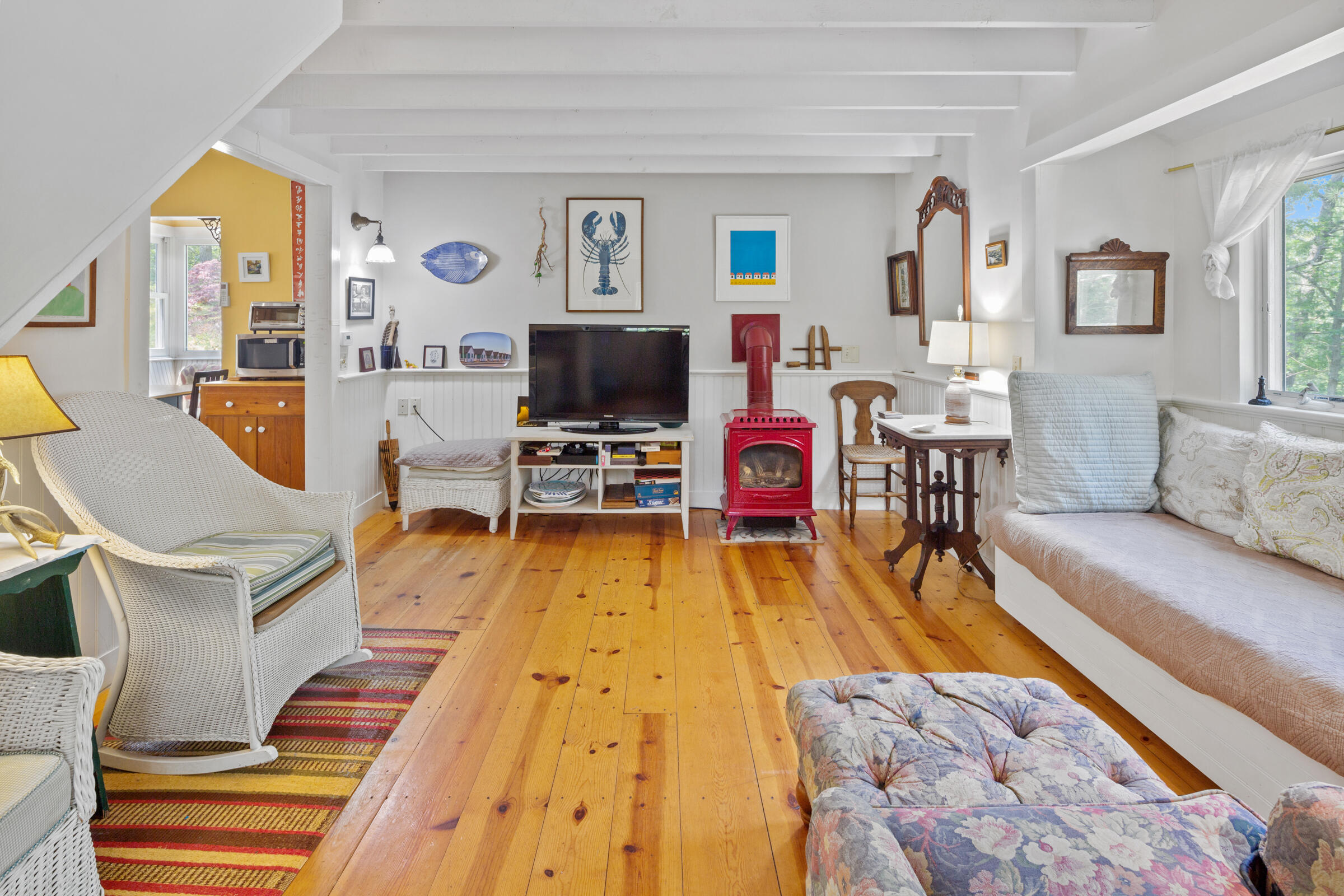 122 Gull Pond Road Wellfleet, MA 02667 - Photo 8 of 26 a living room with furniture and a flat screen tv