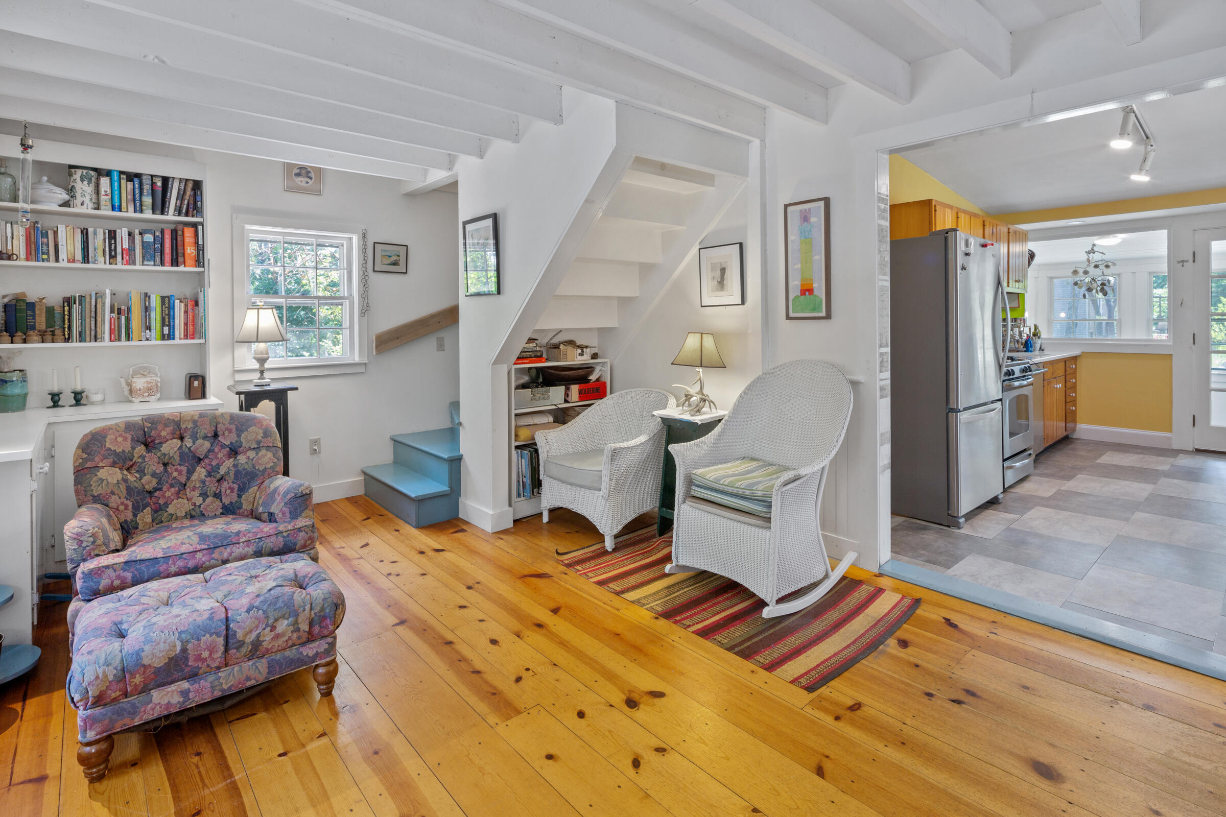 122 Gull Pond Road Wellfleet, MA 02667 - Photo 9 of 26 a living room with furniture and a book shelf