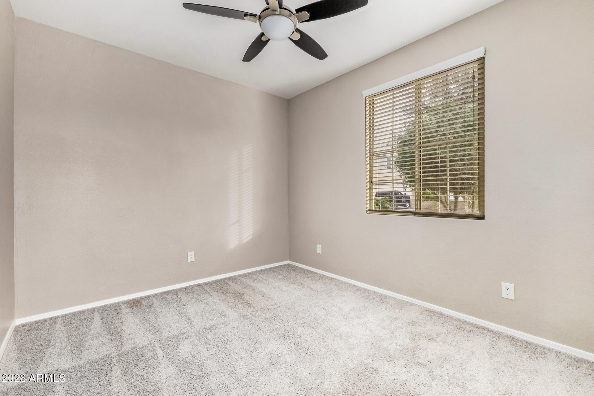 4228 West Coles Road Laveen, AZ 85339 - Photo 20 of 36 a view of an empty room with a window