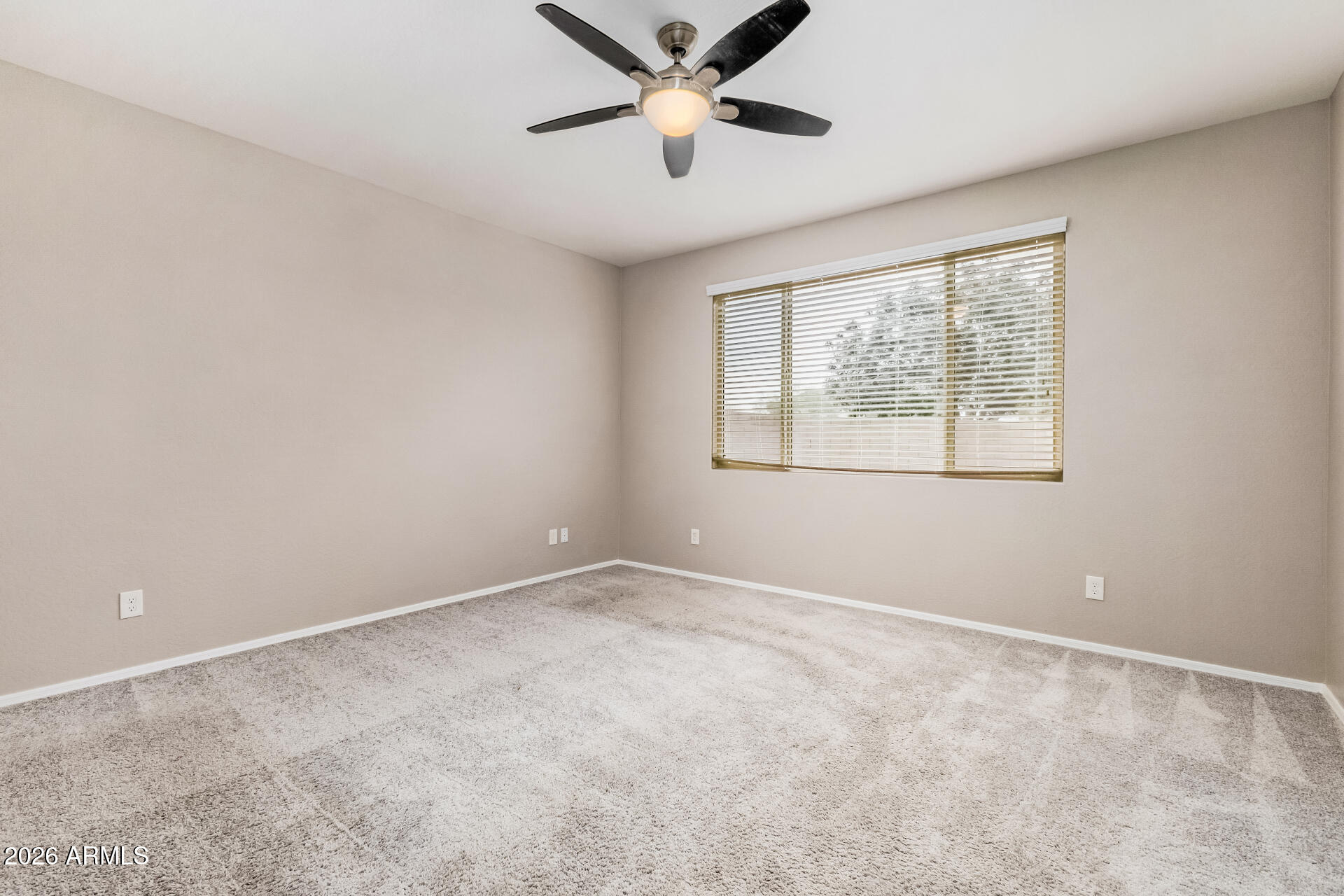 4228 West Coles Road Laveen, AZ 85339 - Photo 23 of 36 a view of an empty room with a window