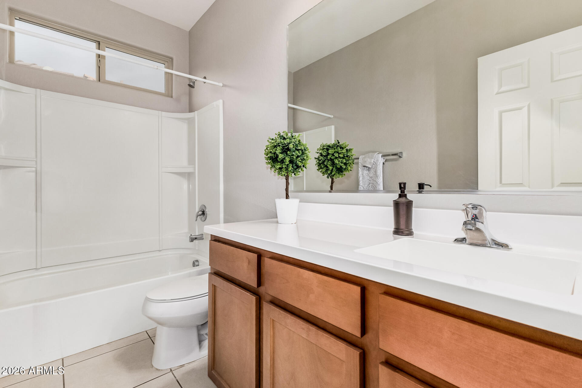 4228 West Coles Road Laveen, AZ 85339 - Photo 25 of 36 a bathroom with a sink a toilet and shower