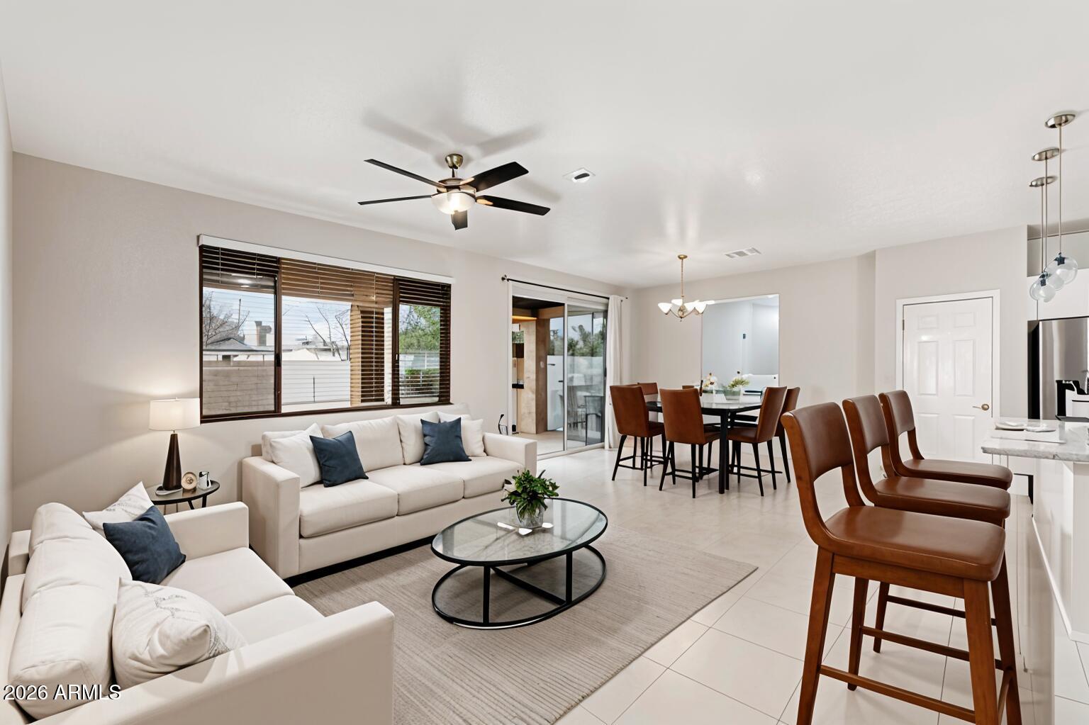 4228 West Coles Road Laveen, AZ 85339 - Photo 5 of 36 a living room with furniture and a large window