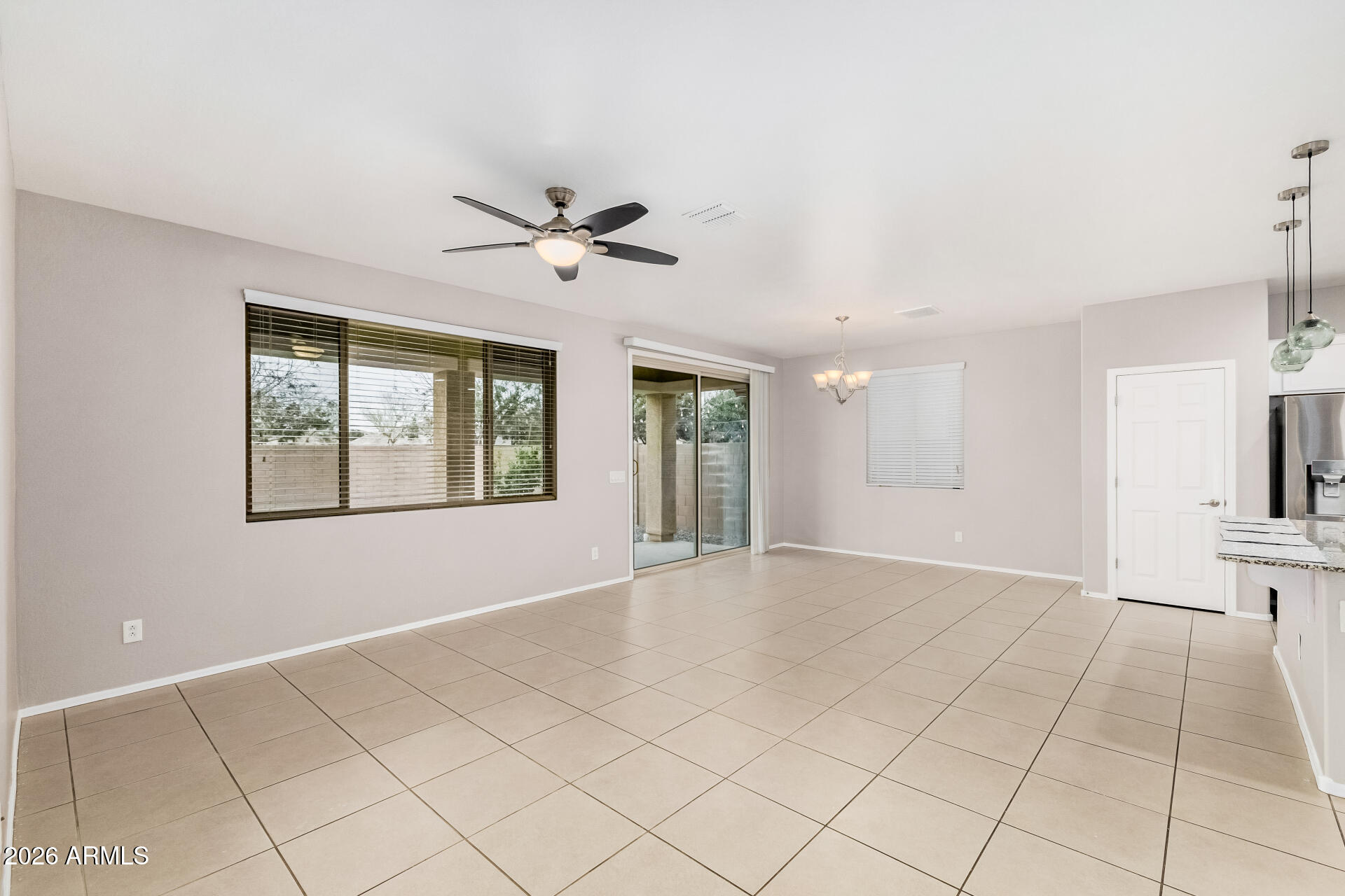4228 West Coles Road Laveen, AZ 85339 - Photo 6 of 36 a view of an empty room with a window