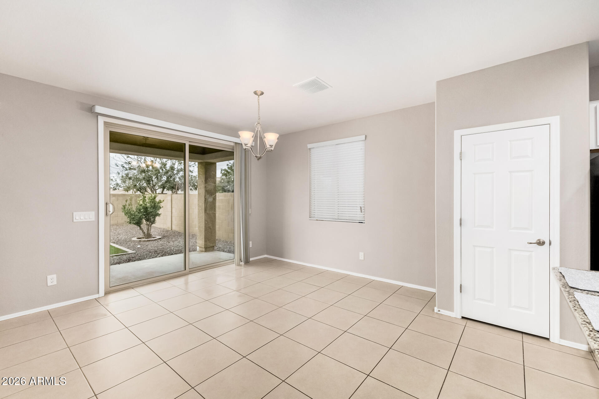 4228 West Coles Road Laveen, AZ 85339 - Photo 7 of 36 a view of an empty room and window