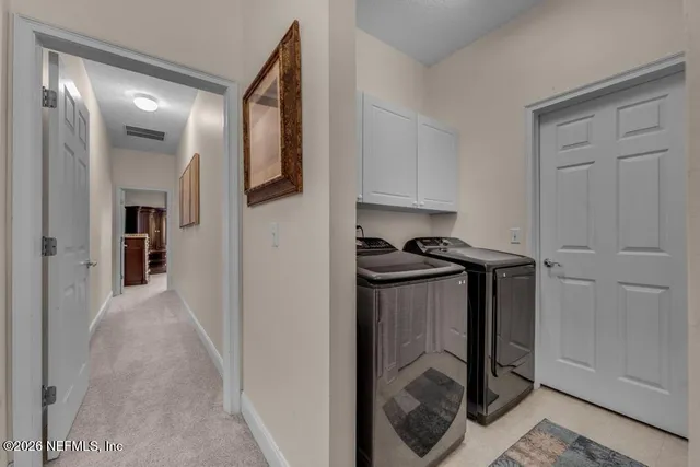 a view of a kitchen from the hallway