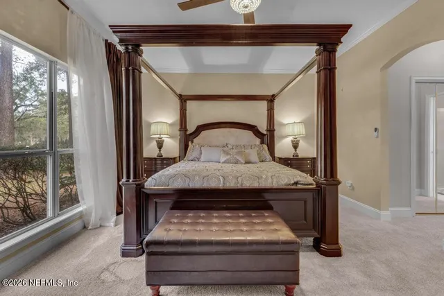 a view of bedroom with furniture and windows