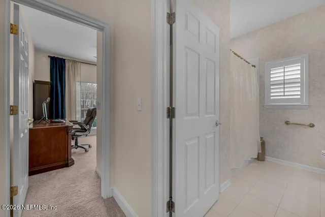 a bathroom with a double vanity sink toilet mirror and shower